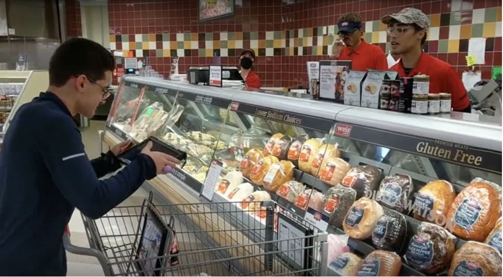 Participant ordering using VVSD at deli counter